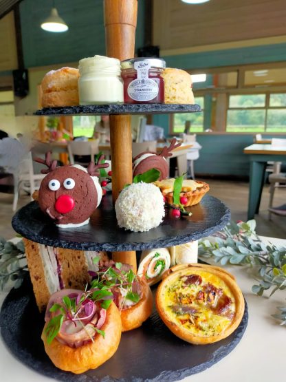 cake stand with mini yorkshire puddings, quiches, rudolph chocolate biscuits, scones, jam & cream